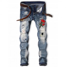GRAPHIC ROSE EMBROIDERED BLEACHED RIPPED JEANS (BLUE)